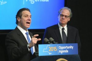 Gov. Cuomo sizes up the share of tourist dollars that will accrue to downtown Niagara Falls businesses after his Niagara Lodge is built in the state park, as his state development honcho, transplanted Brooklynite Howard Zemsky, looks on.