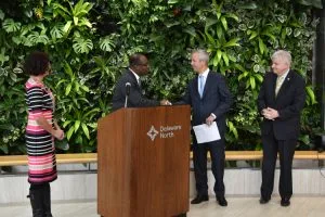 Delaware North co-CEO Lou Jacobs shakes with Buffalo Mayor Byron Brown as Delaware North seals the deal. Kevin Kelly (right) is both president of Delaware North’s travel business and chairman of the Olmsted Park Conservancy’s board of directors. The woman on the left is Stephanie Crockatt, the Conservancy’s executive director.