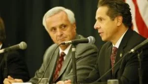 Mark Hamister and Gov. Andrew Cuomo who helped his campaign donor get a free hotel.