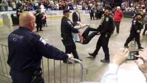 Protester being carried out