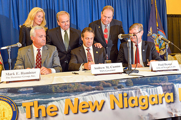 Gov. Andrew Cuomo [center] promised in 2013 a new Niagara. It was tied in part to the tipping point Hamister hotel which has not been built largely because Cuomo's campaign contributor and developer Mark Hamister [left] does not have the financing to build it.  Hamister has inflated the price of the proposed hotel by 100 percent in order to falsely qualify for more taxpayer funding.
The new Niagara is much like the old Niagara.