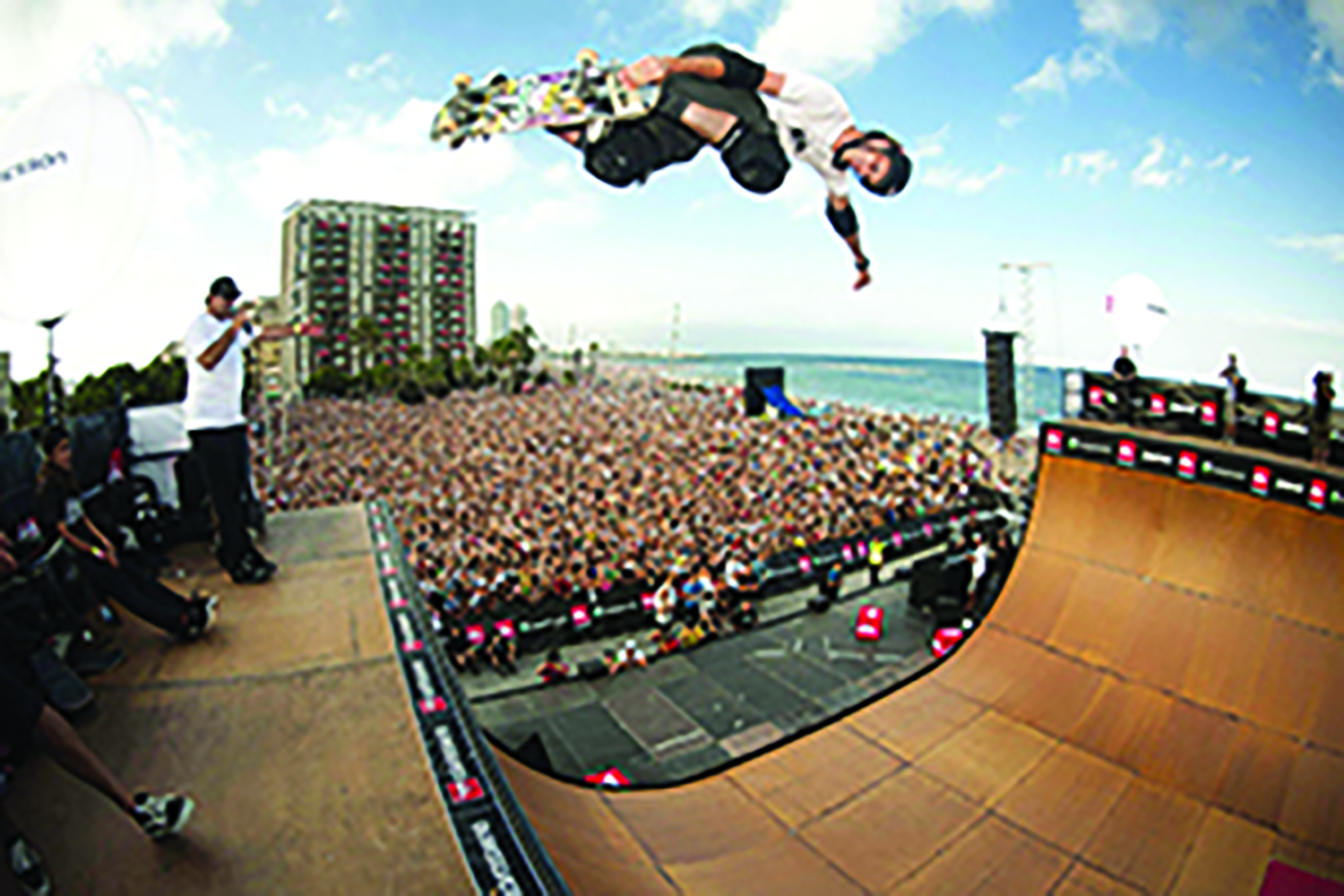 Here’s a picture of skateboard millionaire Tony Hawk risking death for the edification of what looks to be a couple thousand people in the audience on a beach in Southern California. He likes Niagara Falls, because the yokels who run the city government here are even stupider than their counterparts in Beaver Dam, Wisconsin! They bought his skatepark pitch hook, line and sinker, and now he is considering introducing Niagara Falls Mayor Paul Dyster to the wonders of the Hula Hoop.