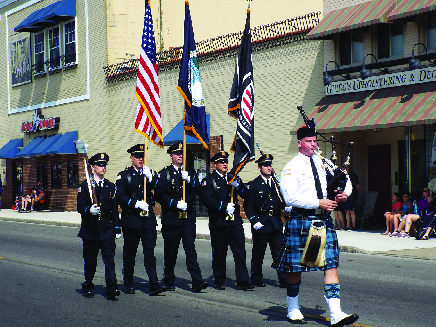 The Niagara Falls Police Department Honor Guard, led by bagpiper Dave Cudahee led the parade down Pine Avenue.