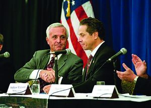 Mark Hamister and his purchased Governor, Andrew Cuomo shake hands as they announce the hotel project will move immediately forward. That was 2013.