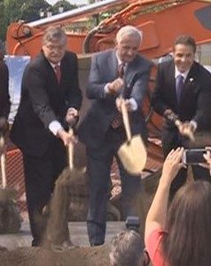Three men with a shovel. While Mayor Paul Dyster (left) may not make a good Santa Claus for the taxpayers of Niagara Falls, he has been a good Santa to millionaire developers like Mark Hamister (center).  Above, Hamister gets help from Mayor Dyster and Gov. Andrew Cuomo (right) in breaking ground for a small hotel with a lot of subsidies, some 300 feet from the entrance to the Niagara Falls State Park.  The Reporter believes the deal involved initially a rigged selection scheme and later a fraudulently, provably, inflated price tag for the smallish, low amenities hotel to be built on one of the most important undeveloped sites in Niagara Falls - in order to secure millions more in taxpayer subsidies for Hamister.   There is a chance that Dyster and Cuomo were secretly complicit in arranging the financing scheme. As Franklin said, "Three can keep a secret if two of them are dead." Let's see how this shakes out.