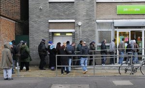 NATIONAL PICTURES People queing up outside a job centre in London. Official fiqures show that people out of work rose by 137,000 to 1.86 million in the three months to October.