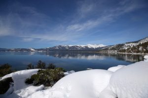 Snow covers the Sierra Nevada mountains and the shoreline of Lake Tahoe on Monday, Jan. 30, 2017, near Memorial Point, Nevada.  (Aric Crabb/Bay Area News Group)