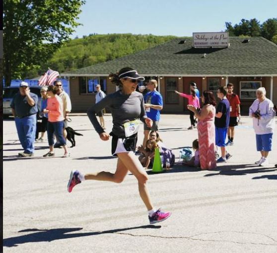 Clare Bronfman completes a half marathon in New Hampshire.
