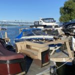 Spider Attack Causes Driver to Lose Control of Vehicle; Crash into Boats Docked at Yacht Club
